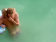 Guy trying to fuck her in the water