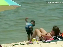 Cute girl fixing her bikini top