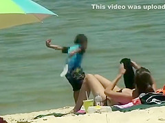 Cute girl fixing her bikini top