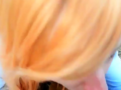 Cute redhead giving blowjob in the woods