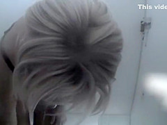 Chubby woman in beach cabin