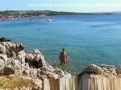 Naked on public beach