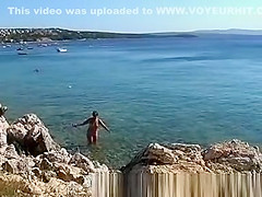 Naked on public beach