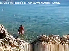 Naked on public beach