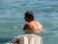 Naked on public beach