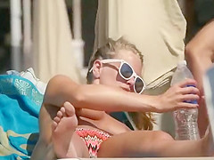 Playful couple spied on the beach