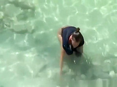 Nudist woman spied in rocky beach