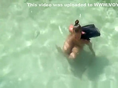 Nudist woman spied in rocky beach