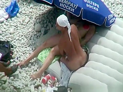 Nude woman preparing food