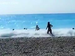 Accidental nudity shown in wavy water