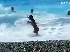 Accidental nudity shown in wavy water