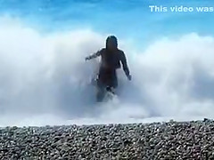 Accidental nudity shown in wavy water