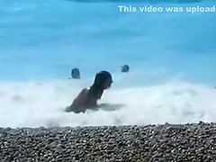 Accidental nudity shown in wavy water