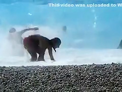 Accidental nudity shown in wavy water