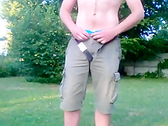 Teasing in thong in the park at sunset