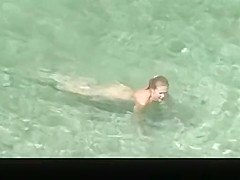 Nudist chick and friends in beach