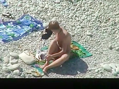 Nudist chick and friends in beach