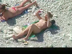 Nudist chick and friends in beach