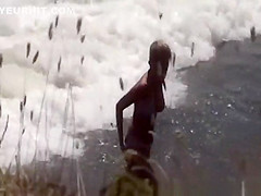 Naturist woman at beach