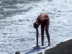 Naturist woman at beach
