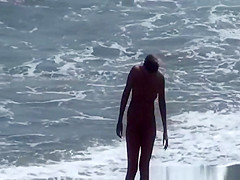 Naturist woman at beach