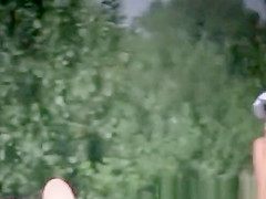 Nude and topless women in beach