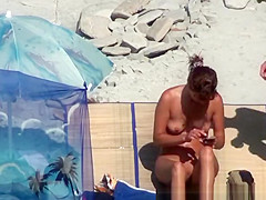 Small boobs woman spied in beach