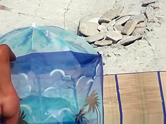 Small boobs woman spied in beach