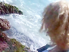Interracial lesbian fuck on the beach