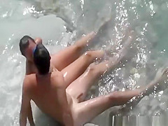 Nudist couple in the water