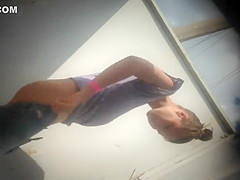 Teen girl dressing after a beach day