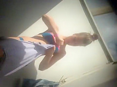 Teen girl dressing after a beach day