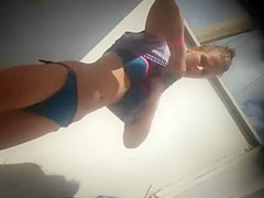 Teen girl dressing after a beach day