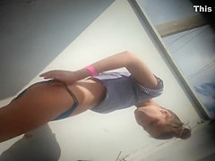 Teen girl dressing after a beach day
