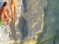 Romantic masturbation on a rocky beach