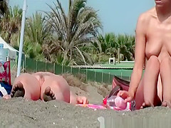 Nudist chicks in water and sunbathing
