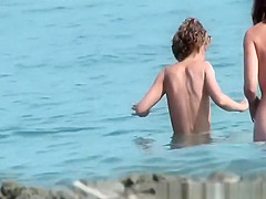 Nudist chicks in water and sunbathing