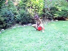 Nude in her garden