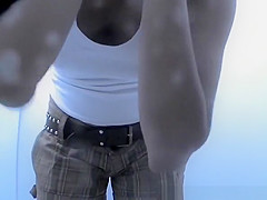 Woman changing bikini bottom for thong