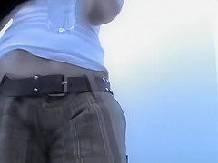 Woman changing bikini bottom for thong