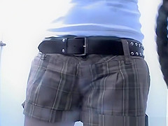 Woman changing bikini bottom for thong