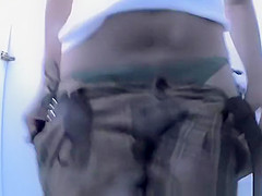 Woman changing bikini bottom for thong