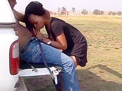 Ebony couple fucking outdoors at back of the truck