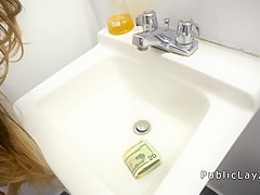 Cute brunette bangs in public restroom