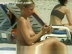 Hot blonde topless at beach