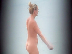 Milf pussy spied in beach cabin