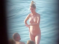 Milf pussy spied in beach cabin