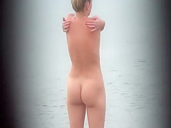 Milf pussy spied in beach cabin