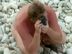 Two teens walking on the beach