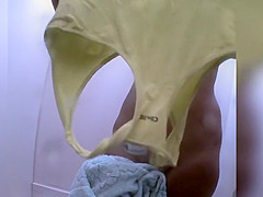 Naked redhead reads on the beach